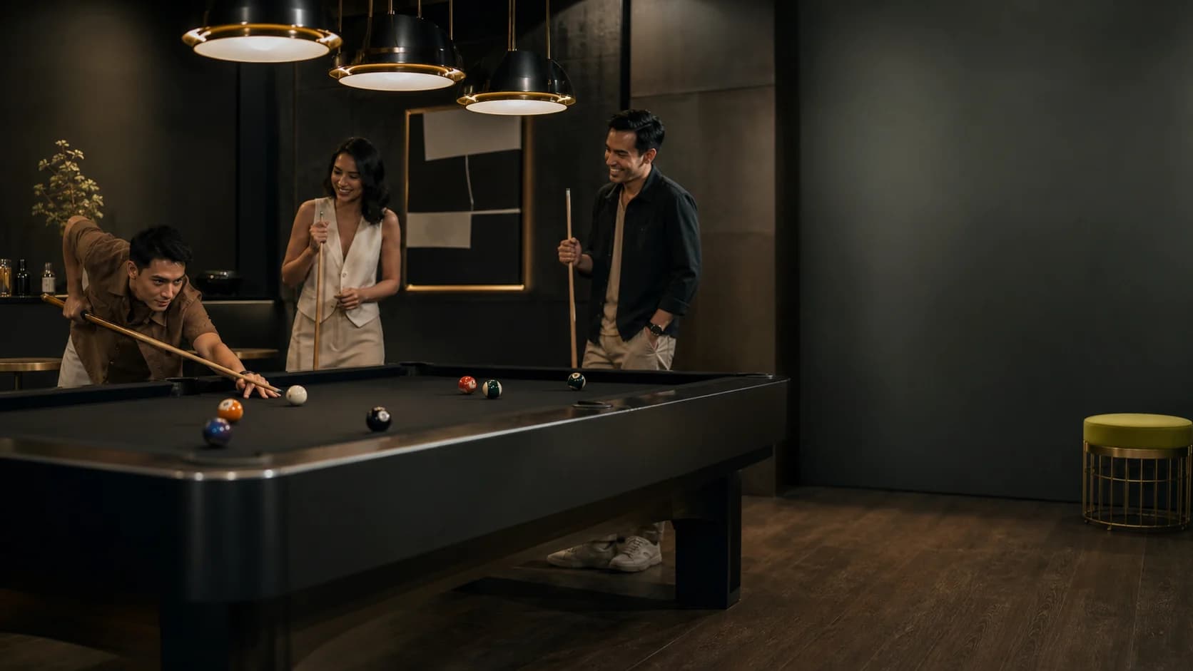 Friends playing billiards in a future recreation setting