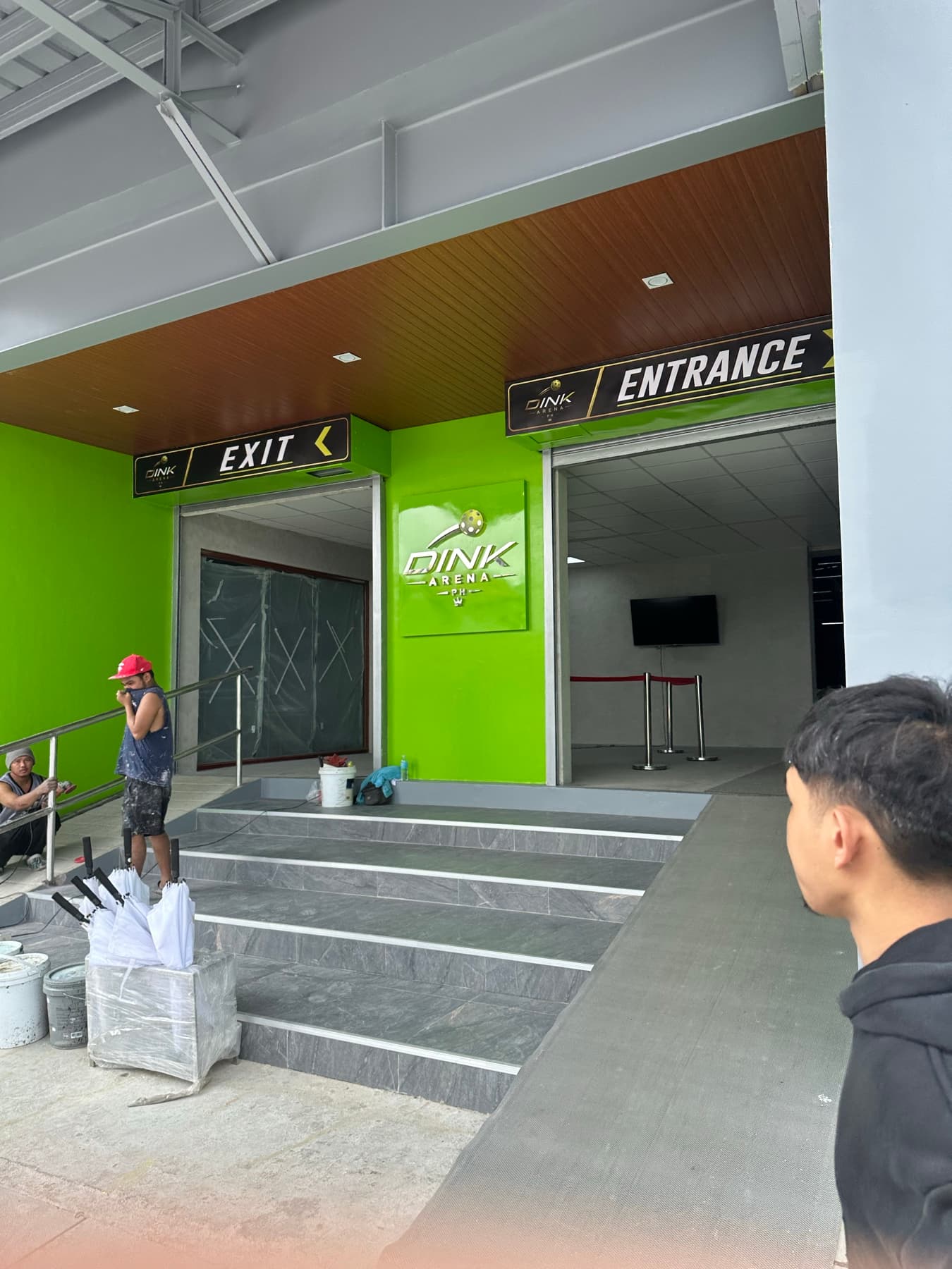 Main entrance and accessible ramp at Dink Arena PH